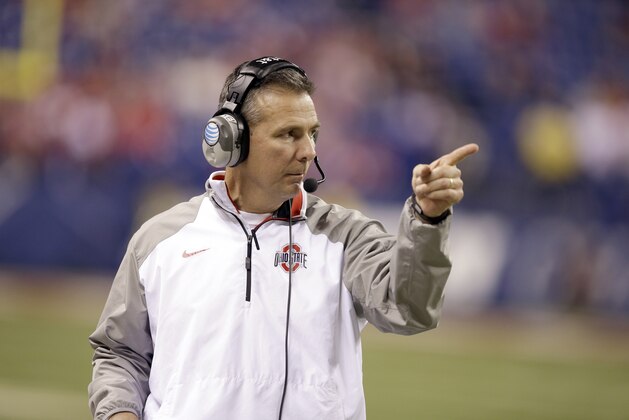 Ohio State head coach Urban Meyer watches from the sidelines during the second half of the Big Ten Conference championship NCAA college football game against Wisconsin Saturday, Dec. 6, 2014, in Indianapolis. (AP Photo/Darron Cummings)