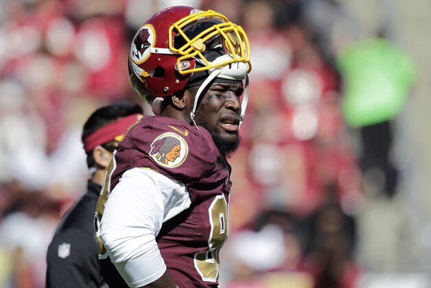 FILE - In this Oct. 19, 2014, file photo, Washington Redskins outside linebacker Brian Orakpo (98) pauses on the field during the first half of an NFL football game against the Tennessee Titans in Landover, Md. Redskins coach Jay Gruden says linebacker Brian Orakpo is done for the season because of a torn right pectoral muscle. Gruden says Monday, Oct. 20, 2014,  that Orakpo needs surgery. (AP Photo/Mark E. Tenally, File)
