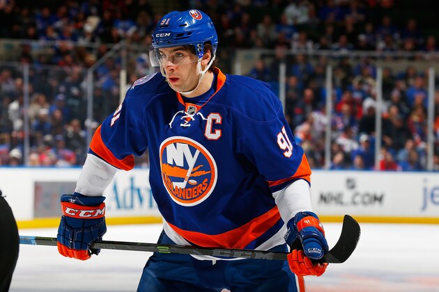 UNIONDALE, NY - FEBRUARY 16:  John Tavares #91 of the New York Islanders skates against the New York Rangers at Nassau Veterans Memorial Coliseum on February 16, 2015 in Uniondale, New York. Rangers defeated the Islanders 6-5.  (Photo by Mike Stobe/NHLI via Getty Images)