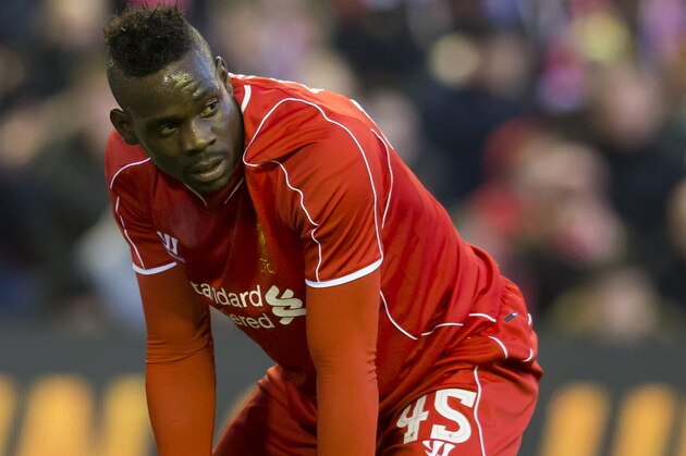 Liverpool's Mario Balotelli kneels on the pitch after a missed opportunity during his team's English FA Cup quarter final soccer match between Liverpool and Blackburn at Anfield Stadium, Liverpool, England, Sunday March 8, 2015. (AP Photo/Jon Super)