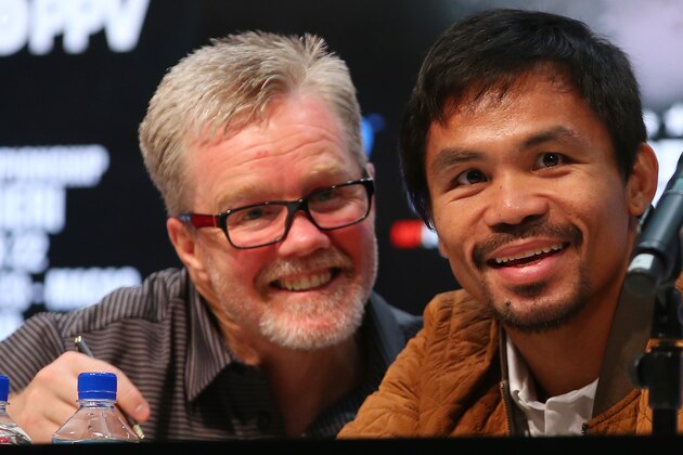 MACAU - NOVEMBER 19:  Manny Pacquiao and coach Freddie Roach talk during a press conference at The Venetian on November 19, 2014 in Macau, Macau.  (Photo by Chris Hyde/Getty Images)