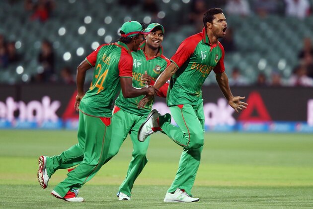 ADELAIDE, AUSTRALIA - MARCH 09: Masrafe Bin Mortaza  (R) of Bangladesh celebrates after getting the wicket of Joe Root of England during the 2015 ICC Cricket World Cup match between England and Bangladesh at Adelaide Oval on March 9, 2015 in Adelaide, Australia.  (Photo by Morne de Klerk/Getty Images)