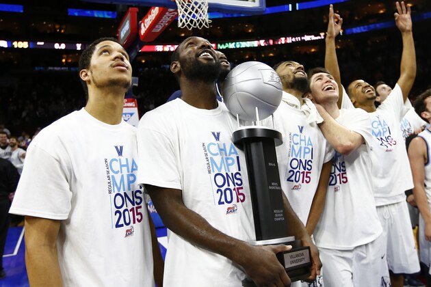 PHILADELPHIA, PA - MARCH 7: Josh Hart #3, JayVaughn Pinkston #22, Darrun Hilliard #4, Ryan Arcidiacono #15 and Phil Booth #5 of the Villanova Wildcats celebrate with the Big East Regular Season Championship Trophy after defeating the St. John's Red Storm 105-68 in an NCAA college basketball game on March 7, 2015 at the Wells Fargo Center in Philadelphia, Pennsylvania. (Photo by Rich Schultz /Getty Images)