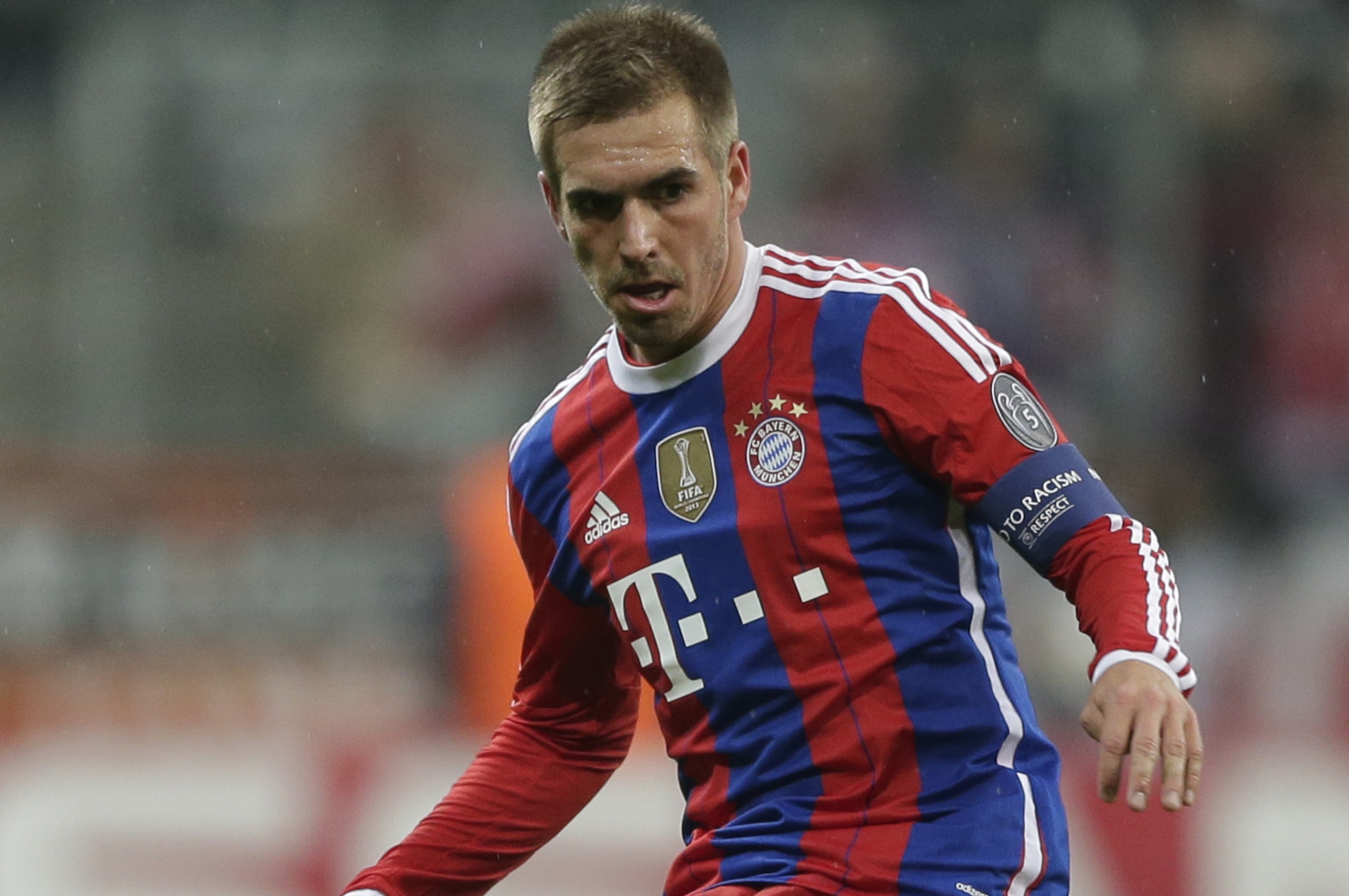 Bayern's Philipp Lahm kicks the ball during the Champions League Group E soccer match between FC Bayern Munich and AS Roma at Allianz Arena in Munich, southern Germany, Wednesday Nov. 5, 2014. (AP Photo/Matthias Schrader)