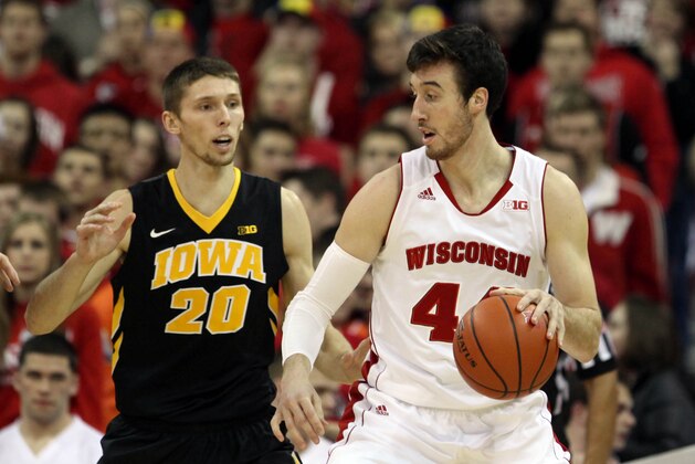 Jan 20, 2015; Madison, WI, USA; Wisconsin Badgers forward Frank Kaminsky (44)  move the ball around Iowa Hawkeyes forward Jarrod Uthoff (20) during the first half at the Kohl Center. Mandatory Credit: Mary Langenfeld-USA TODAY Sports