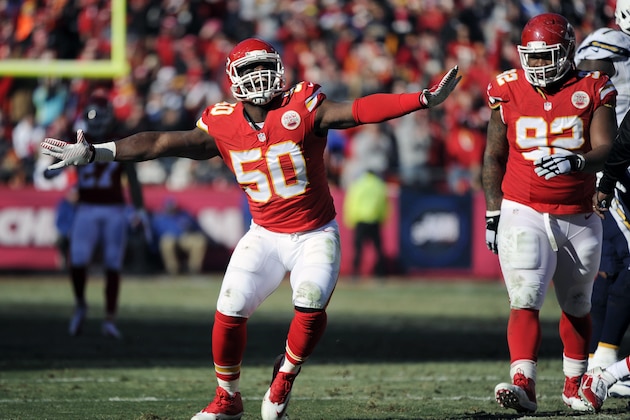 Kansas City Chiefs outside linebacker Justin Houston (50) celebrates a sacking of San Diego Chargers quarterback Philip Rivers with Chiefs nose tackle Dontari Poe (92) looking on during the first half of an NFL football game in Kansas City, Mo., Sunday, Dec. 28, 2014. (AP Photo/Ed Zurga)