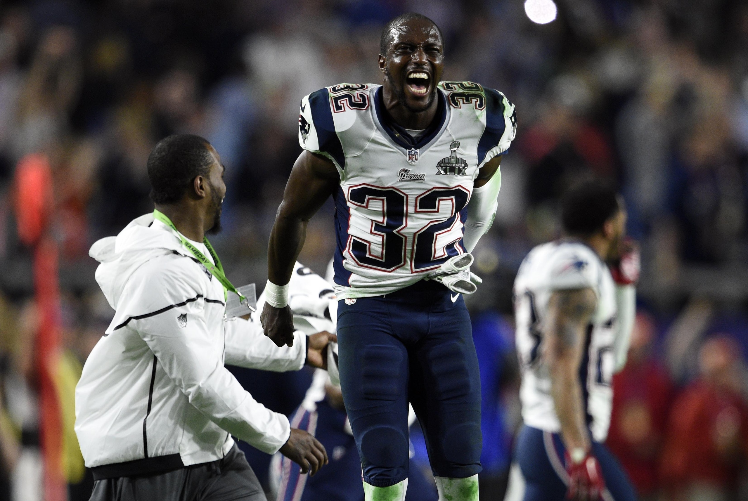 Feb 1, 2015; Glendale, AZ, USA; New England Patriots free safety Devin McCourty (32) reacts after defeating the Seattle Seahawks in  Super Bowl XLIX at University of Phoenix Stadium. Mandatory Credit: Kyle Terada-USA TODAY Sports