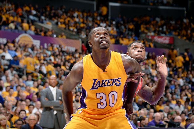 LOS ANGELES, CA - OCTOBER 28: Julius Randle #30 of the Los Angeles Lakers battles for position against the Houston Rockets on October 28, 2014 at the Staples Center in Los Angeles, California. NOTE TO USER: User expressly acknowledges and agrees that, by downloading and/or using this Photograph, user is consenting to the terms and conditions of Getty Images License Agreement. Mandatory Copyright Notice: Copyright 2014 NBAE (Photo by Andrew D. Bernstein/NBAE via Getty Images)