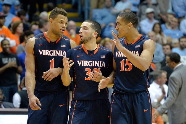 CHAPEL HILL, NC - FEBRUARY 02:  (L-R) Justin Anderson #1, London Perrantes #32 and Malcolm Brogdon #15 of the Virginia Cavaliers huddle in the final minute of a win against the North Carolina Tar Heels at the Dean Smith Center on February 2, 2015 in Chapel Hill, North Carolina. Virginia won 75-64.  (Photo by Grant Halverson/Getty Images)