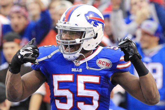 Buffalo Bills defensive end Jerry Hughes celebrates after scoring on a fumble recovery against the Cleveland Browns during the second half of an NFL football game, Sunday, Nov. 30, 2014, in Orchard Park, N.Y. (AP Photo/Bill Wippert)