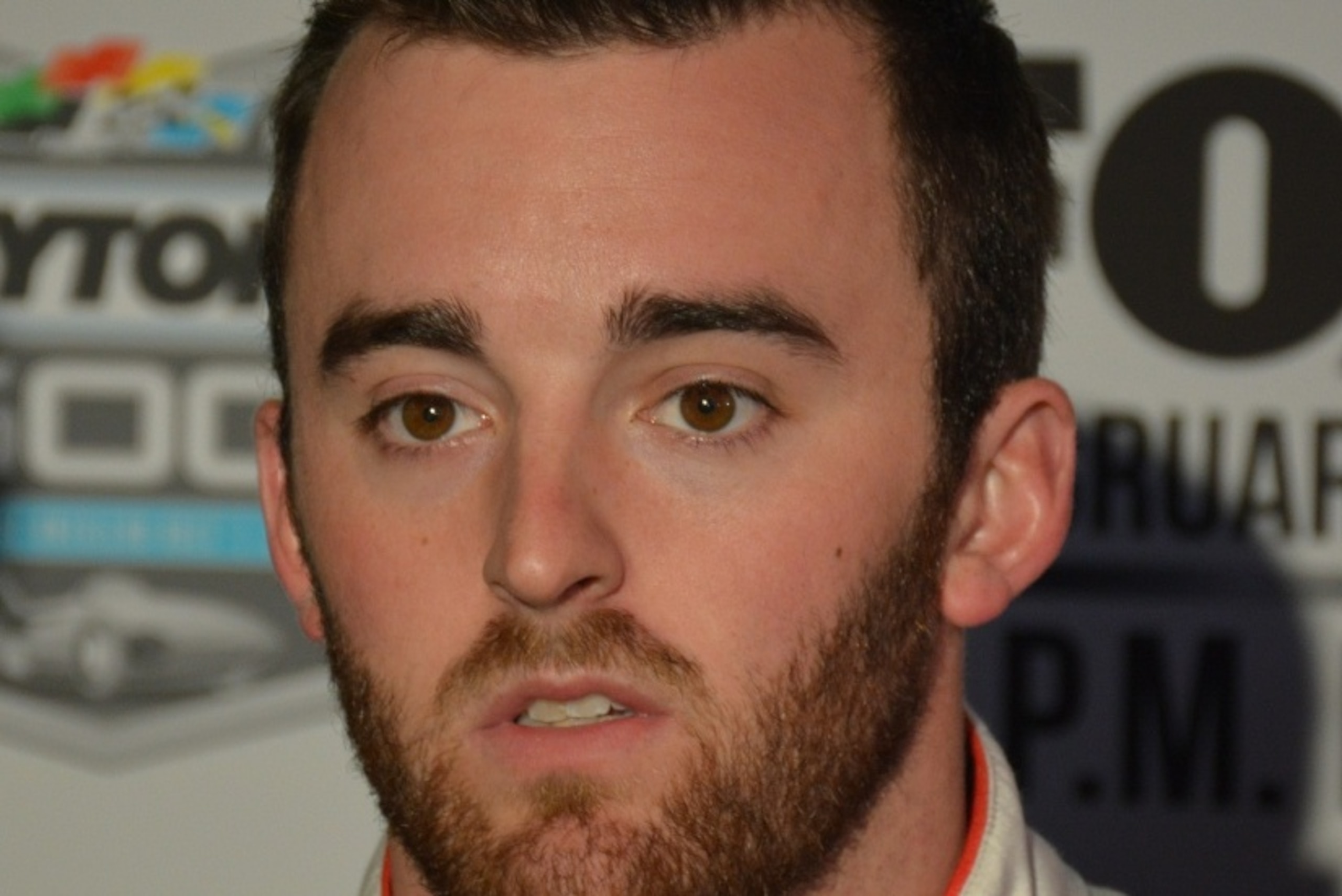 Austin Dillon waits for media questions at Daytona International Speedway