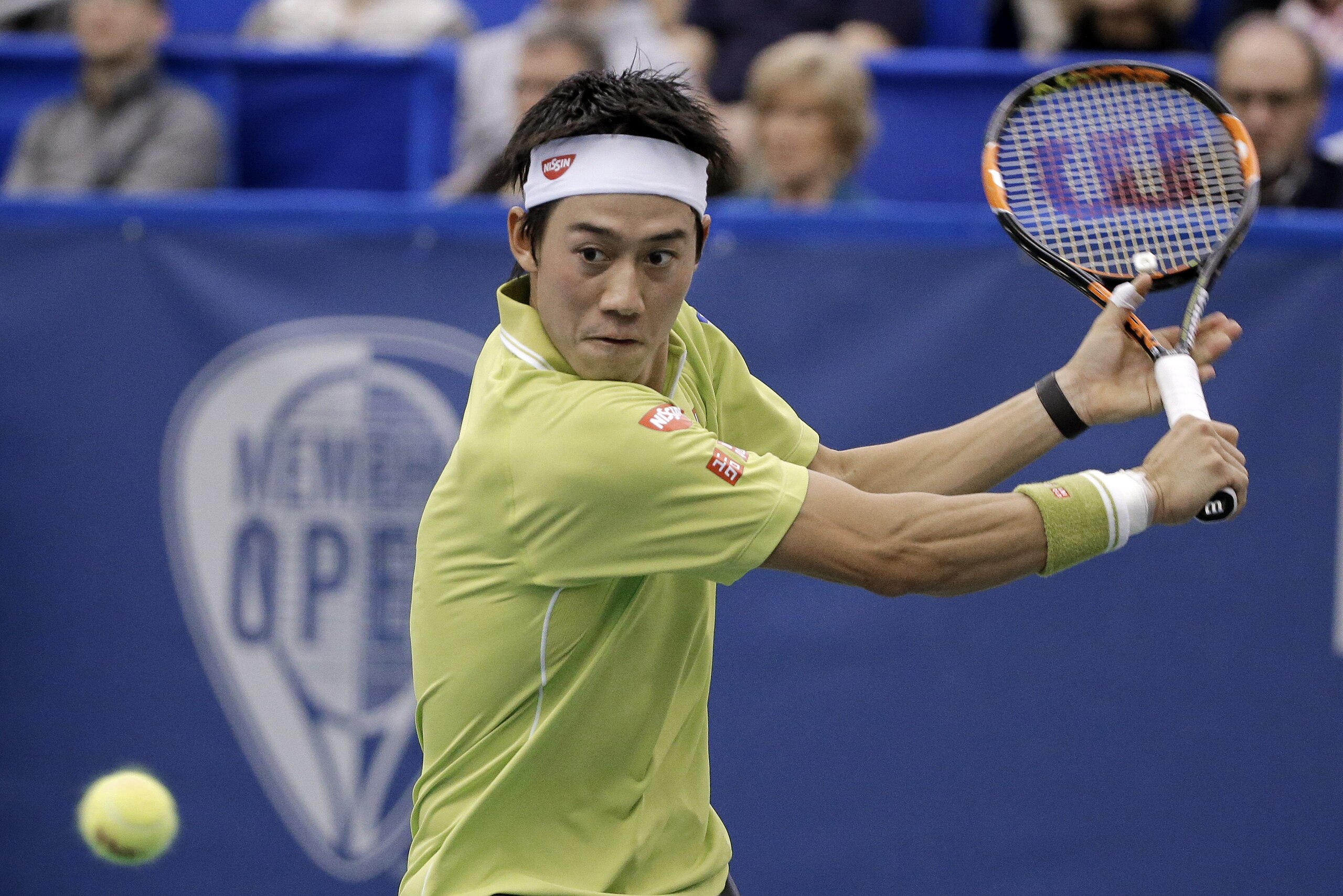 Kei Nishikori, of Japan, returns a shot to Kevin Anderson, of South Africa, in the championship match of the Memphis Open tennis tournament Sunday, Feb. 15, 2015, in Memphis, Tenn. Nishikori won 6-4, 6-4. (AP Photo/Mark Humphrey)