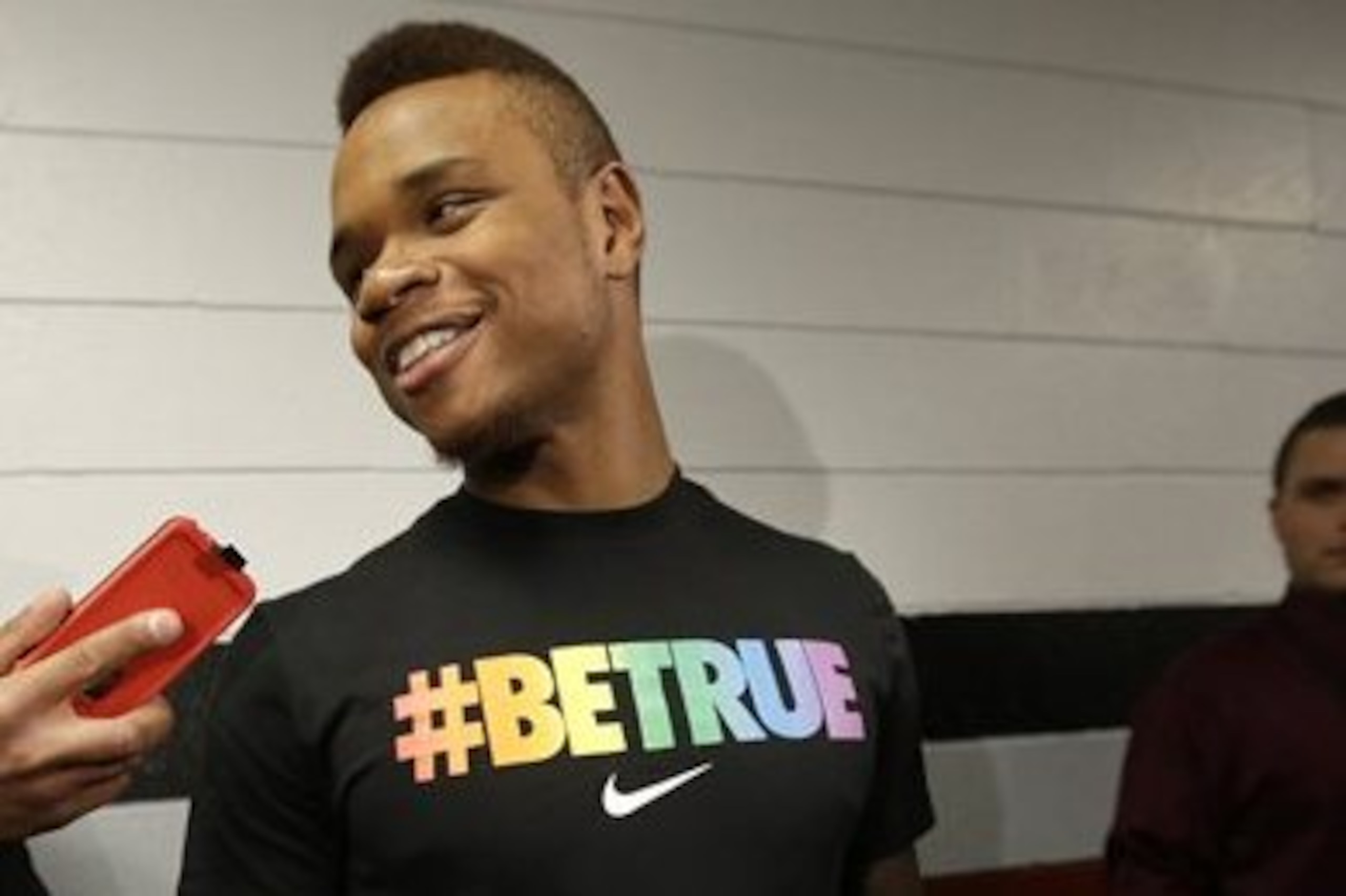 University of Massachusetts basketball guard Derrick Gordon, 22, faces reporters on the school's campus, Wednesday, April 9, 2014, in Amherst, Mass. Gordon has become the first openly gay player in Division I men's basketball. (AP Photo/Steven Senne)