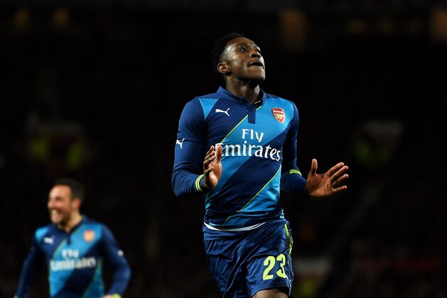MANCHESTER, ENGLAND - MARCH 09:  Danny Welbeck of Arsenal celebrates after scoring his team's second goal during the FA Cup Quarter Final match between Manchester United and Arsenal at Old Trafford on March 9, 2015 in Manchester, England.  (Photo by Laurence Griffiths/Getty Images)