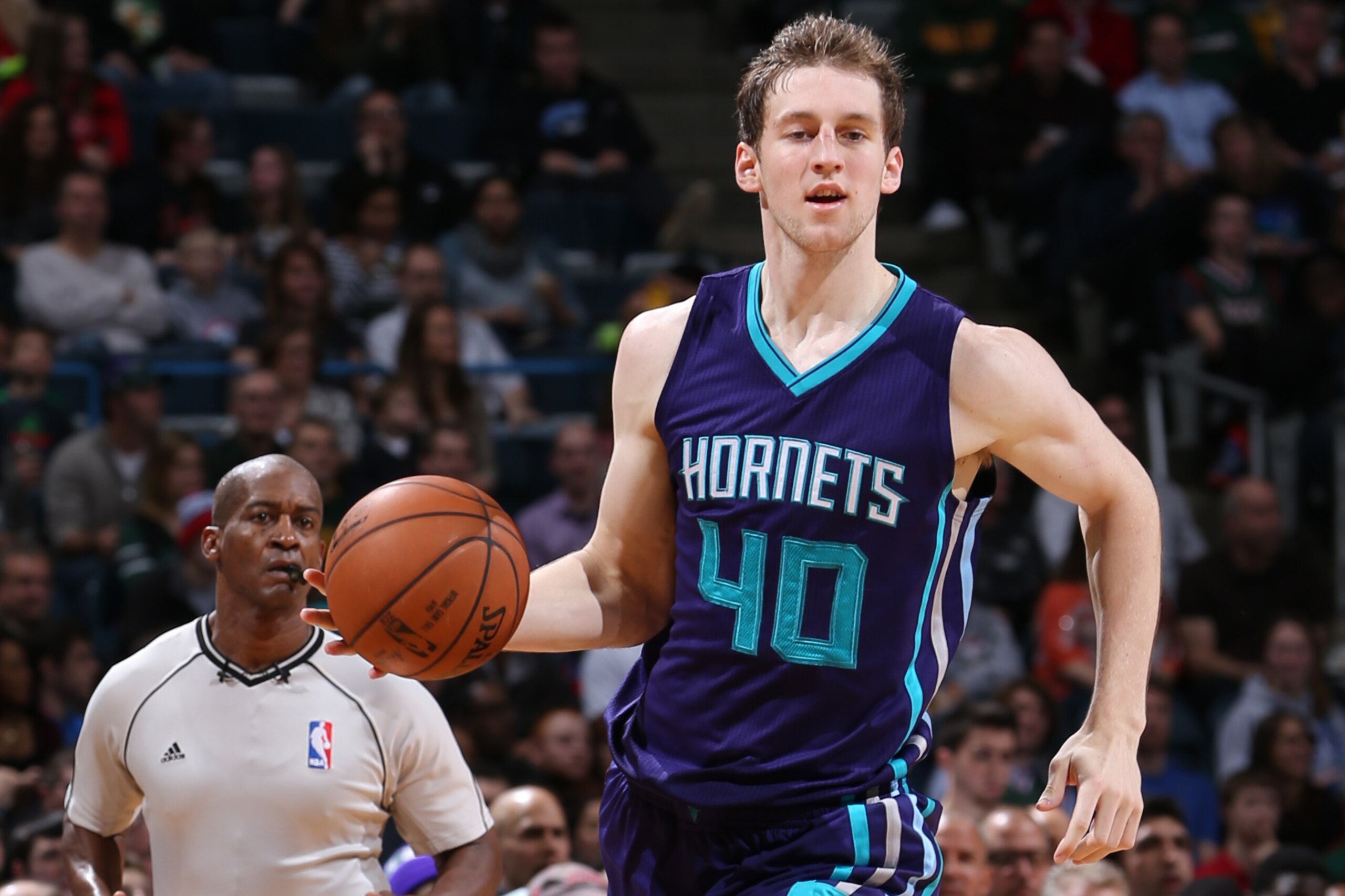 MILWAUKEE, WI - DECEMBER 23: Cody Zeller #40 of the Charlotte Hornets handles the ball against the Milwaukee Bucks on December 23, 2014 at the BMO Harris Bradley Center in Milwaukee, Wisconsin. NOTE TO USER: User expressly acknowledges and agrees that, by downloading and or using this Photograph, user is consenting to the terms and conditions of the Getty Images License Agreement. Mandatory Copyright Notice: Copyright 2014 NBAE (Photo by Gary Dineen/NBAE via Getty Images)