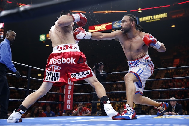 Keith Thurman, right, trades punches with Robert Guerrero during their boxing match, Saturday, March 7, 2015, in Las Vegas. Thurman won by unanimous decision. (AP Photo/Eric Jamison)