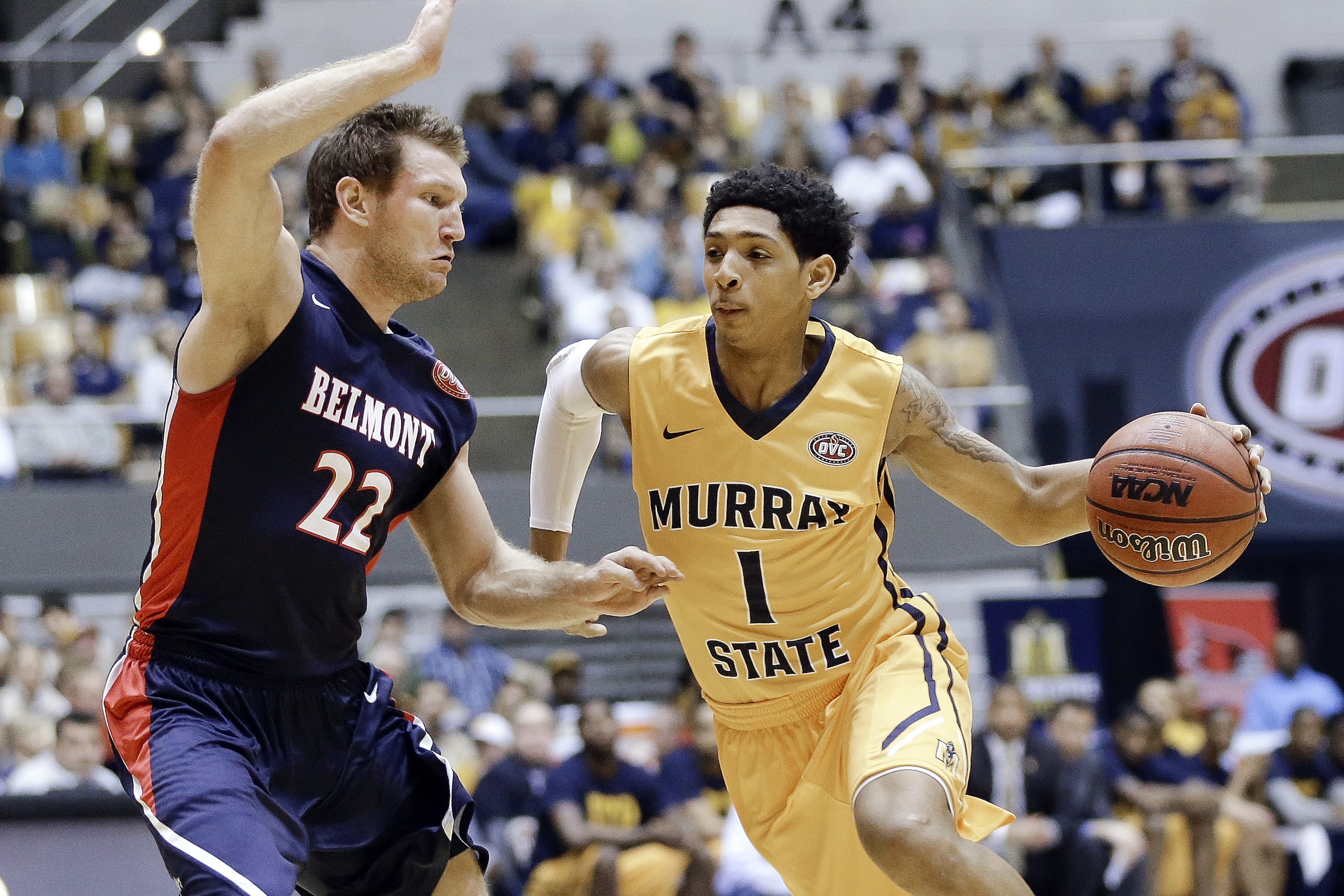 Murray State guard Cameron Payne (1) drives against Belmont guard Reece Chamberlain (22) during the first half of an NCAA college basketball game in the final of the Ohio Valley Conference tournament Saturday, March 7, 2015, in Nashville, Tenn. (AP Photo/Mark Humphrey)