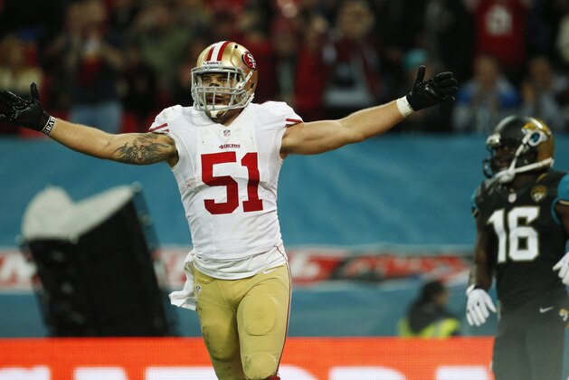 San Francisco 49ers outside linebacker Dan Skuta (51) celebrates after scoring a 47-yard touchdown run after recovering a fumble by Jacksonville Jaguars tight end Marcedes Lewis during the second half of an NFL football game at Wembley Stadium, London, Sunday, Oct. 27, 2013.  (AP Photo/Matt Dunham)