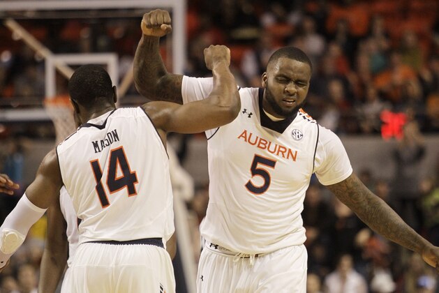 Dec 20, 2014; Auburn, AL, USA; Auburn Tigers forward Cinmeon Bowers (5) and guard Antione Mason (14) celebrate after a play agains the Xavier Musketeers  during the second half at Auburn Arena. The Tigers beat the Musketeers 89-88 in double overtime. Mandatory Credit: John Reed-USA TODAY Sports