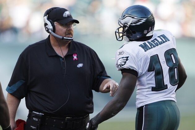 Philadelphia Eagles head coach Andy Reid talks to wide receiver Jeremy Maclin (18) during the second half of an NFL football game against the Atlanta Falcons on Sunday, Oct. 17, 2010, in Philadelphia.  (AP Photo/Mike Groll)