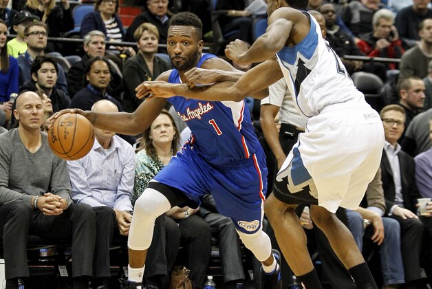 Mar 2, 2015; Minneapolis, MN, USA; Los Angeles Clippers guard Jordan Hamilton (1) drives to the basket around Minnesota Timberwolves forward Andrew Wiggins (22) in the first quarter at Target Center. Mandatory Credit: Bruce Kluckhohn-USA TODAY Sports