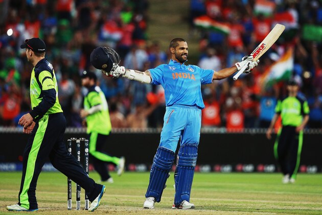 HAMILTON, NEW ZEALAND - MARCH 10:  Shikhar Dhawan of India celebrates after scoring a century during the 2015 ICC Cricket World Cup match between Ireland and India at Seddon Park on March 10, 2015 in Hamilton, New Zealand.  (Photo by Hannah Peters/Getty Images)