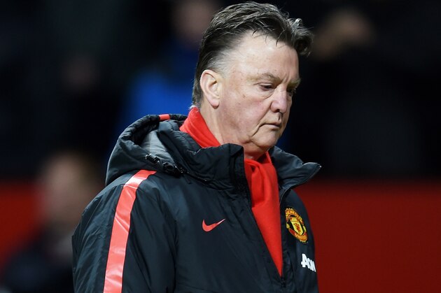 MANCHESTER, ENGLAND - MARCH 09:  A dejected Louis van Gaal the manager of Manchester United  walks off the pitch following his team's 2-1 defeat during the FA Cup Quarter Final match between Manchester United and Arsenal at Old Trafford on March 9, 2015 in Manchester, England.  (Photo by Michael Regan/Getty Images)