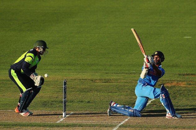 HAMILTON, NEW ZEALAND - MARCH 10:  Shikhar Dhawan of India pulls the ball away for four runs during the 2015 ICC Cricket World Cup match between Ireland and India at Seddon Park on March 10, 2015 in Hamilton, New Zealand.  (Photo by Hannah Peters/Getty Images)