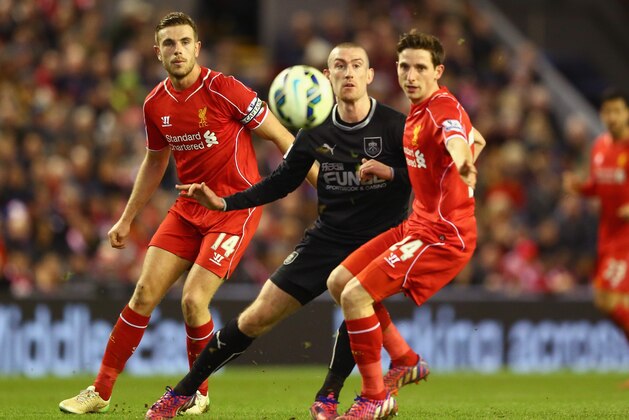 LIVERPOOL, ENGLAND - MARCH 04:  Jordan Henderson and Joe Allen of Liverpool close down David Jones of Burnley during the Barclays Premier League match between Liverpool and Burnley at Anfield on March 4, 2015 in Liverpool, England.  (Photo by Michael Steele/Getty Images)