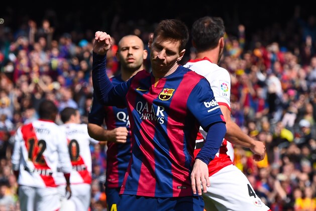 BARCELONA, SPAIN - MARCH 08:  Lionel Messi of FC Barcelona celebrates after scoring from the penalty spot his team's third goal during the La Liga match between FC Barcelona and Rayo Vallecano de Madrid at Camp Nou on March 8, 2015 in Barcelona, Spain.  (Photo by David Ramos/Getty Images)