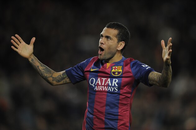 FC Barcelona's Daniel Alves, from Brazil, celebrates a goal during a Spanish La Liga soccer match against Espanyol at the Camp Nou stadium in Barcelona, Spain, Sunday, Dec. 7, 2014. (AP Photo/Manu Fernandez)