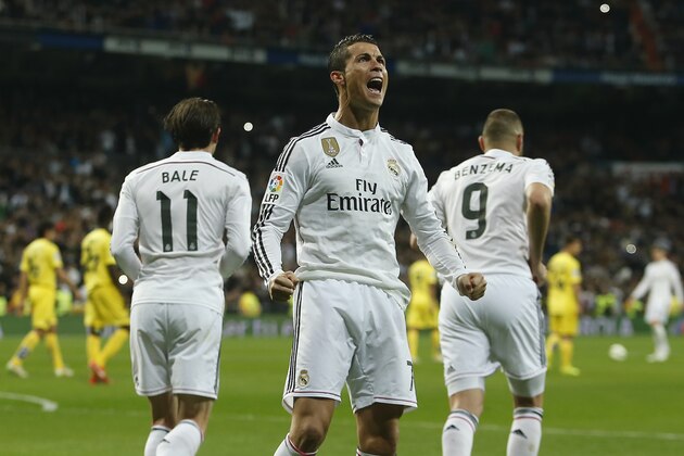 Real Madrid's Cristiano Ronaldo, centre, celebrates his goal during a Spanish La Liga soccer match between Real Madrid and Villarreal at the Santiago Bernabeu stadium in Madrid, Spain, Sunday, March 1, 2015. (AP Photo/Andres Kudacki)