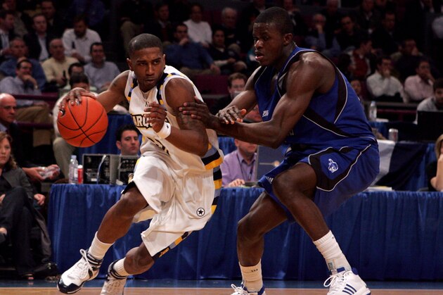 NEW YORK - MARCH 12:  Eugene Harvey #15 of the Seton Hall Pirates defends the drive of Jerel McNeal #22 of the Marquette Golden Eagles during the 2008 Big East Men's Basketball Championship at Madison Square Garden on March 12, 2008 in New York City.  (Photo by Jim McIsaac/Getty Images)
