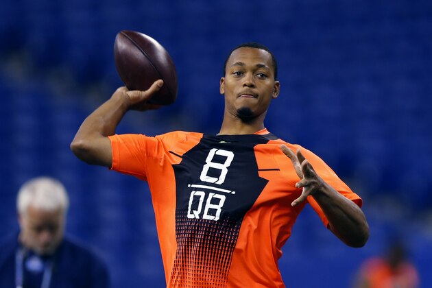 UCLA quarterback Brett Hundley runs a drill at the NFL football scouting combine in Indianapolis, Saturday, Feb. 21, 2015. (AP Photo/Julio Cortez)