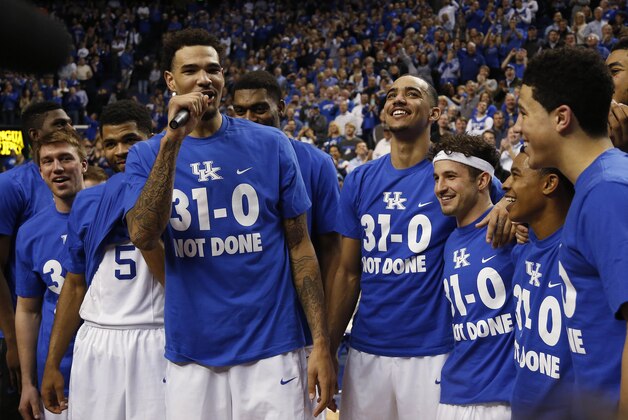 FILE - In this March 7, 2015, file photo, Kentucky's Willie Cauley-Stein, third from left, address the crowd during a ceremony marking the teams undefeated season after an NCAA college basketball game against Florida in Lexington, Ky. Kentucky won 67-50. Kentucky coach John Calipari seems unfazed by the prospect of a conference tournament loss, as long as it's the last one his team suffers in pursuit of national championship No. 9.(AP Photo/James Crisp, File)