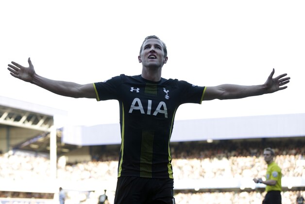 Tottenham’s Harry Kane celebrates after scoring his second goal of the game during the English Premier League soccer match between Queens Park Rangers and Tottenham Hotspur at the Loftus Road stadium London, Saturday, March, 7, 2015. (AP Photo/Alastair Grant)