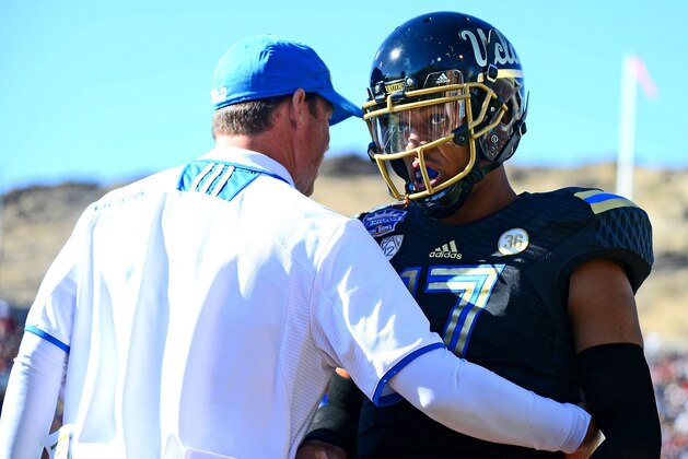 Dec 31, 2013; El Paso, TX, USA; UCLA Bruins head coach Jim Mora congratulates  quarterback Brett Hundley (17) after scoring a touchdown during the second quarter against the Virginia Tech Hokies in the 2013 Sun Bowl at Sun Bowl Stadium. Mandatory Credit: Andrew Weber-USA TODAY Sports