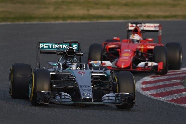 MONTMELO, SPAIN - MARCH 01:  Sebastian Vettel of Germany and Ferrari follows Nico Rosberg of Germany and Mercedes GP during day four of the final Formula One Winter Testing at Circuit de Catalunya on March 1, 2015 in Montmelo, Spain.  (Photo by Michael Regan/Getty Images)
