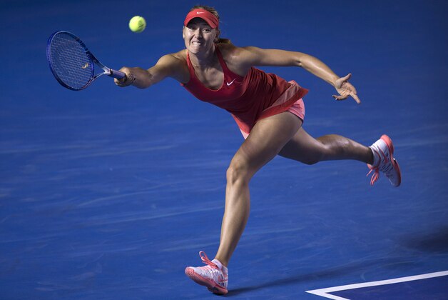 In this Feb. 26, 2015 photo, Maria Sharapova of Russia returns the ball to Magdalena Rybarikova of Slovakia during a Mexican Tennis Open quarterfinal match in Acapulco, Mexico. Top-seeded Sharapova beat Rybarikova to reach the Mexico Open semifinals. (AP Photo/Christian Palma)