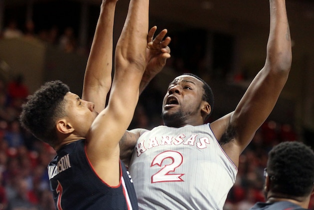 Kansas' Cliff Alexander shoots against Texas Tech's Isaiah Manderson during a NCAA college basketball game in Lubbock, Texas, Tuesday, Feb. 10, 2015. (AP Photo/Zach Long)