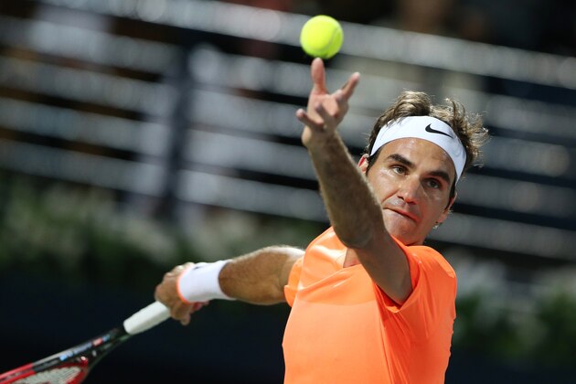 Roger Federer of Switzerland serves the ball to Novak Djokovic of Serbia during the final match of the Dubai Duty Free Tennis Championships in Dubai, United Arab Emirates, Saturday, Feb. 28, 2015. (AP Photo/Kamran Jebreili)