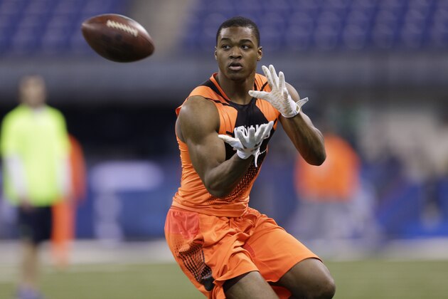 Alabama wide receiver Amari Cooper runs a drill at the NFL football scouting combine in Indianapolis, Saturday, Feb. 21, 2015. (AP Photo/David J. Phillip)