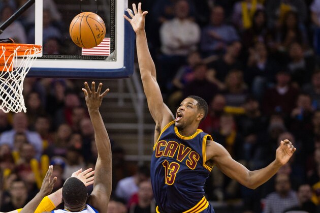 CLEVELAND, OH - FEBRUARY 26: Kevin Love #0 and Tristan Thompson #13 of the Cleveland Cavaliers try to stop Draymond Green #23 of the Golden State Warriors during the second half at Quicken Loans Arena on February 26, 2015 in Cleveland, Ohio. The Cavaliers defeated the Warriors 110-99. NOTE TO USER: User expressly acknowledges and agrees that, by downloading and or using this photograph, User is consenting to the terms and conditions of the Getty Images License Agreement. (Photo by Jason Miller/Getty Images)