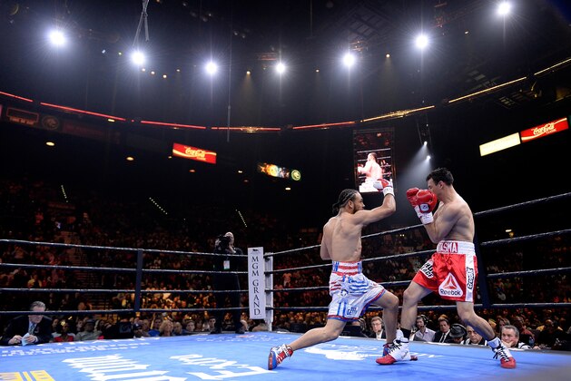 LAS VEGAS, NV - MARCH 07:  Robert Guerrero (red trunks) and Keith Thurman (white trunks) fight during a Premier Boxing Champions bout in the MGM Grand Garden Arena on March 7, 2015 in Las Vegas, Nevada.  (Photo by Harry How/Getty Images)
