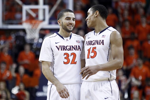 Virginia guard London Perrantes (32) and guard Malcolm Brogdon (15) smile during the second half of an NCAA college basketball game against Pittsburgh in Charlottesville, Va., on Monday, Feb. 16, 2015. Virginia won 61-49. (AP Photo/Ryan M. Kelly)
