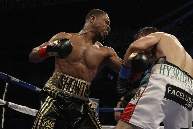 Shawn Porter, left, fights Alfonso Gomez during a NABO welterweight title fight in San Jose, Calif., Saturday, July 28, 2012. Porter won by unanimous decision. (AP Photo/Jeff Chiu)