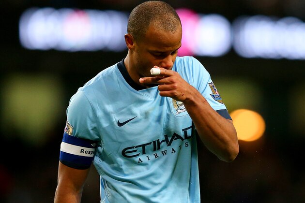 MANCHESTER, ENGLAND - JANUARY 24:  Vincent Kompany of Manchester City shows his dejection during the FA Cup Fourth Round match between Manchester City and Middlesbrough at Etihad Stadium on January 24, 2015 in Manchester, England.  (Photo by Alex Livesey/Getty Images)