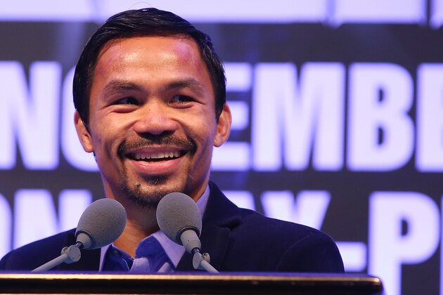 MACAU - NOVEMBER 23:  Manny Pacquiao of the Philippines speaks to media at the post fight press conference after winning against Chris Algieri of the United States during the WBO world welterweight title at The Venetian on November 23, 2014 in Macau, Macau.  (Photo by Chris Hyde/Getty Images)