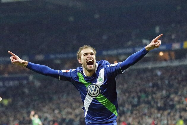 Wolfsburg's Bas Dost from the Netherlands  celebrates after scoring  during the German first division Bundesliga soccer match between Werder Bremen and VfL Wolfsburg in Bremen, Germany, Sunday, March 1, 2015. (AP Photo/Frank Augstein)