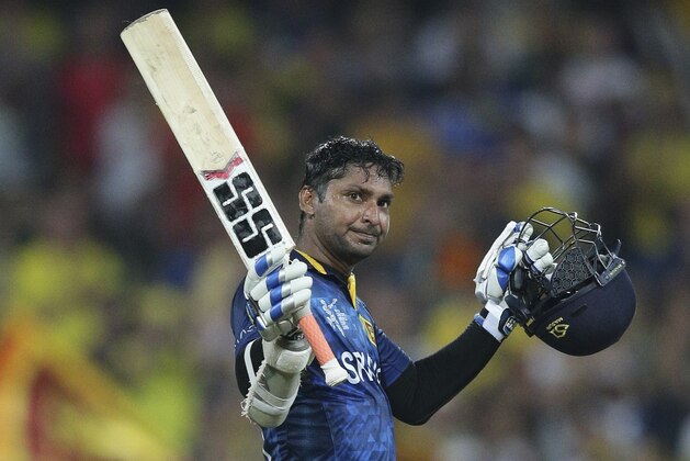 FILE PHOTO - In this Sunday March 8, 2015 file photo Sri Lankan batsman Kumar Sangakkara, celebrates his hundred runs during his Cricket World Cup Pool A match against Australia in Sydney, Australia. Sangakkara has scored an unprecedented fourth consecutive century at the World Cup during his team's Pool A match against Scotland in Hobart Wednesday March 11, 2015. (AP Photo/Rob Griffith,File)